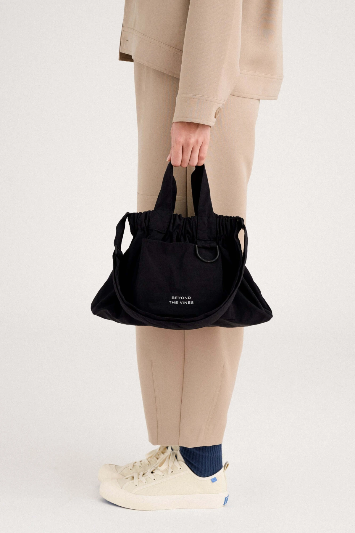 Model Holding Bag in Studio