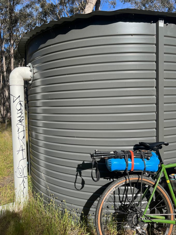 A rainwater tank and bicycle