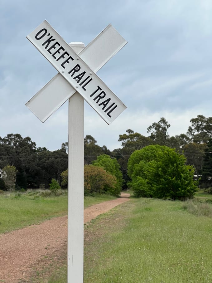 A street post signifying the start of the rail trail