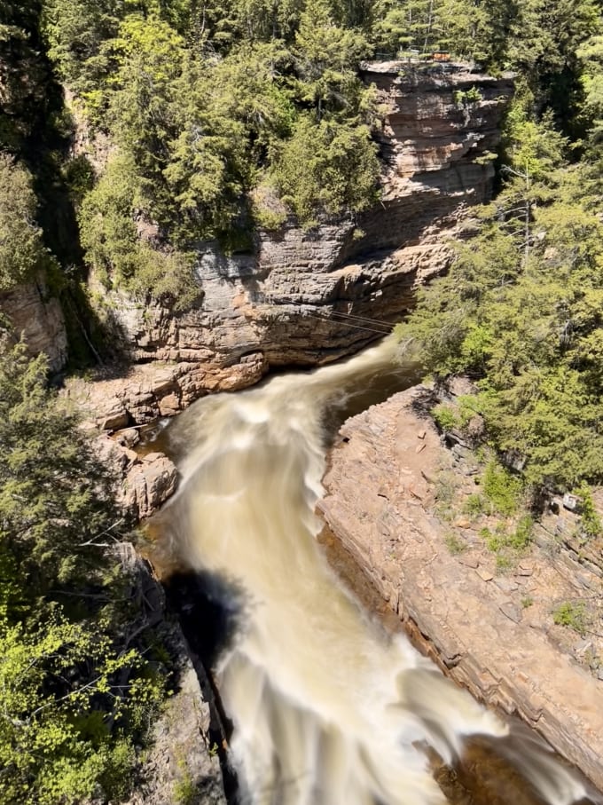 Looking down at water rushing through the Ausable Chasm