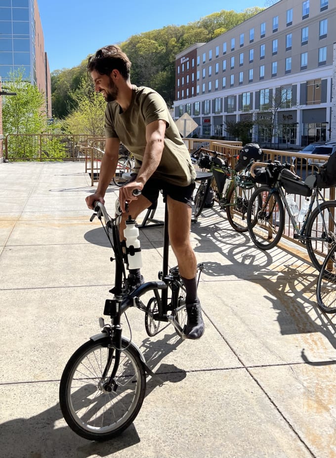 Danny riding a Brompton fold-up bicycle