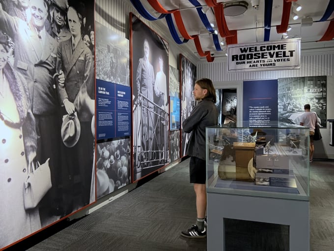 Myles reading a display at the museum