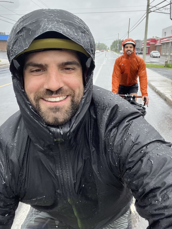 Lukas and Danny riding bikes in wet weather