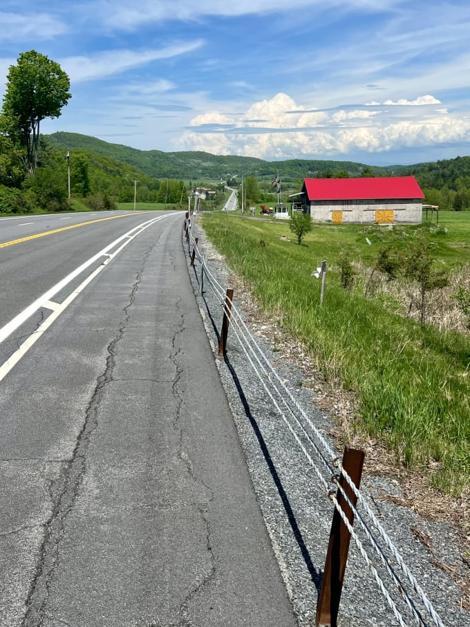 The shoulder of a state highway going up and down hills