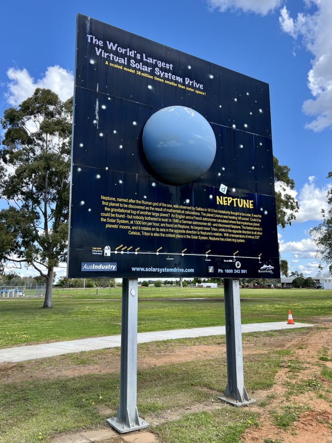 A fibreglass model of Neptune on the side of the road