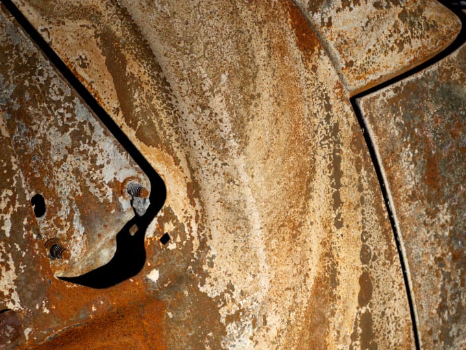 The burnt-out remains of a car, which could be mistaken for sandstone.