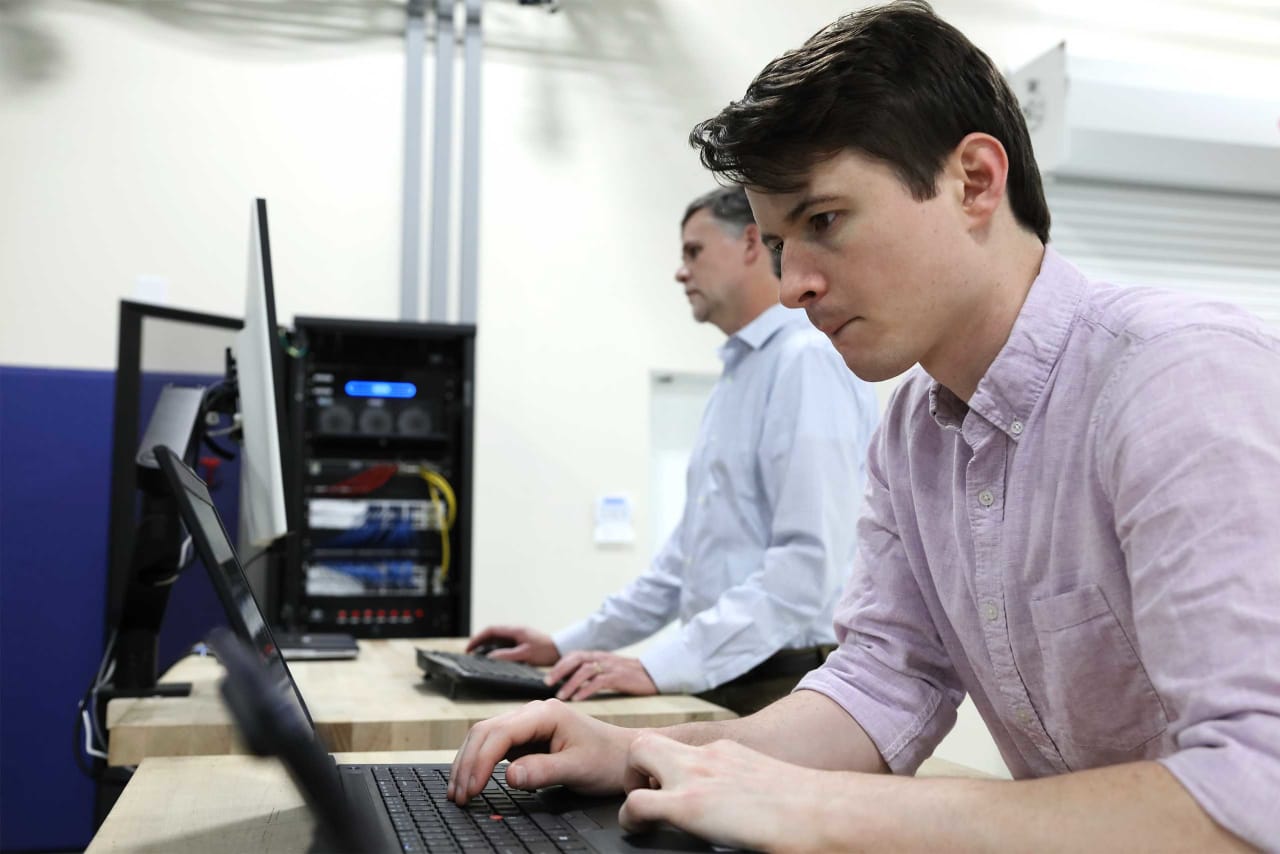 Staff members working in the performance lab.