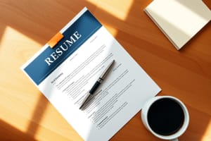 Editorial photo of a resume on a warm wooden desk with fountain pen and coffee.