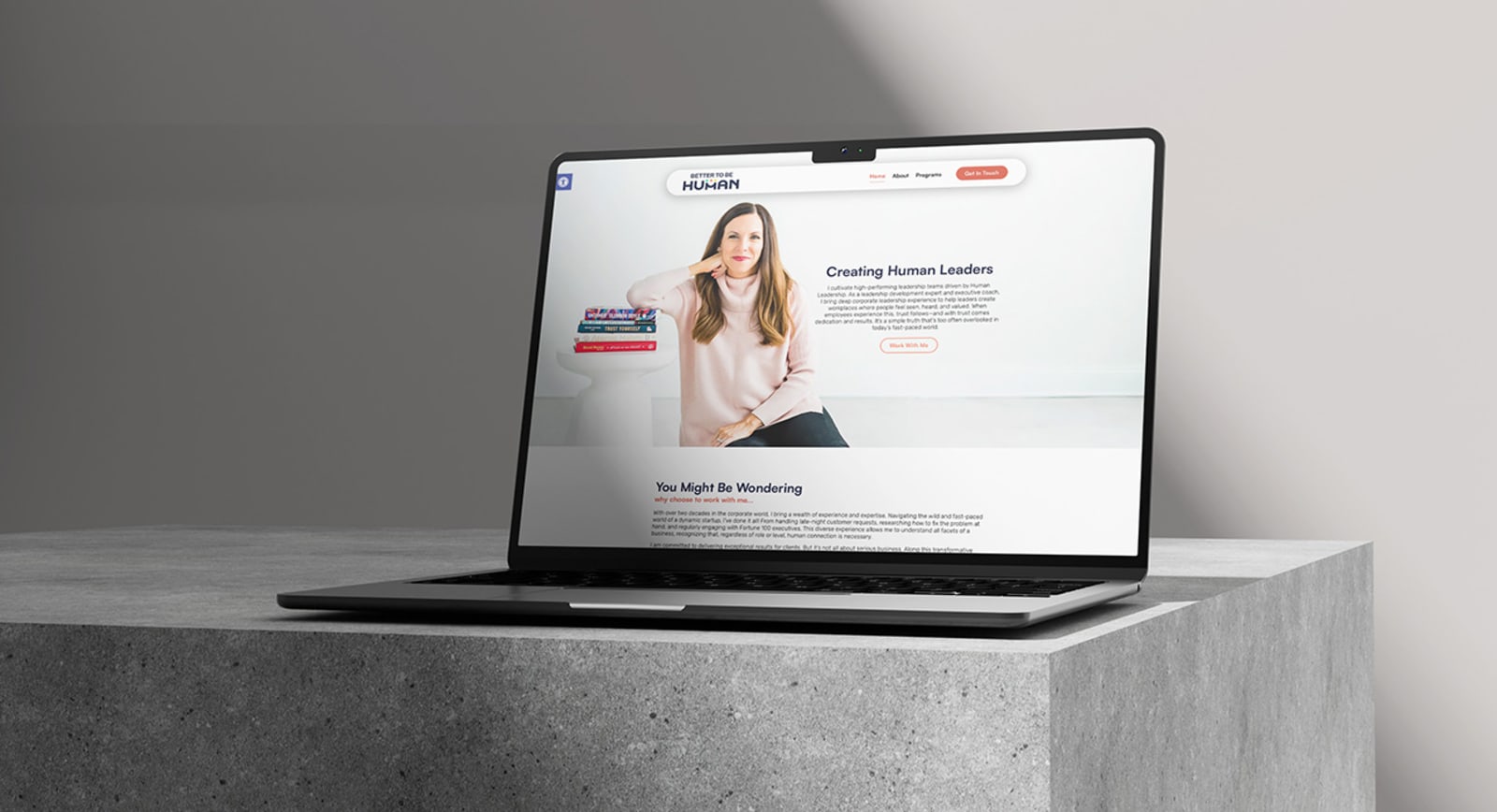 The Better To Be Human website shown on a laptop