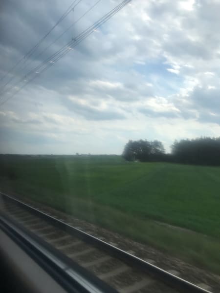 Fields through train window