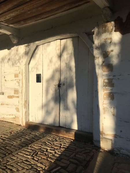 sun on pretty white wood door gates in lanckorona