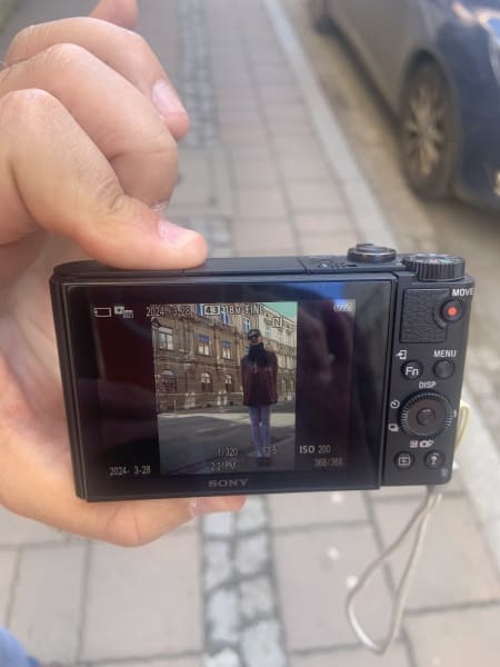 a photo of a camera showing a photo of me a man took on the street