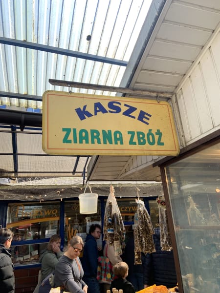 old sign that says kasze ziarna zbóż at stary kleparz