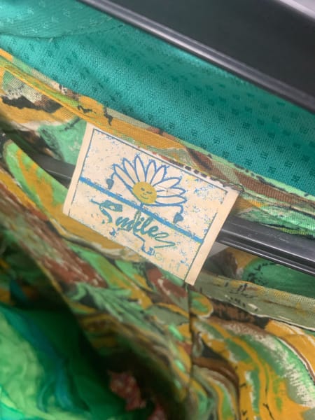 tag on clothes that says smile