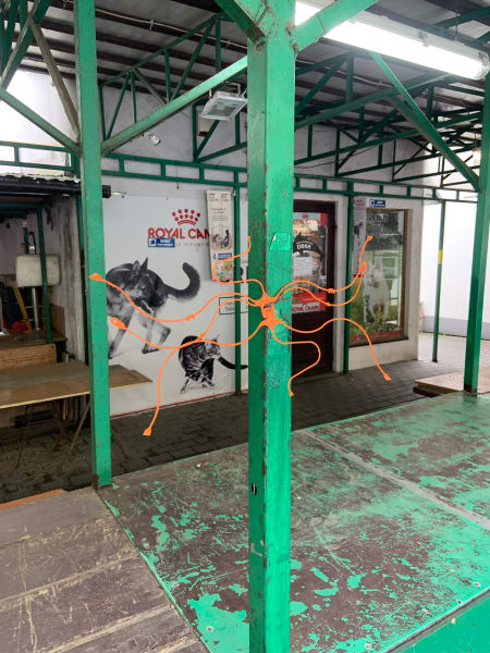 weird orange plastic thing on green frame at plac na stawach