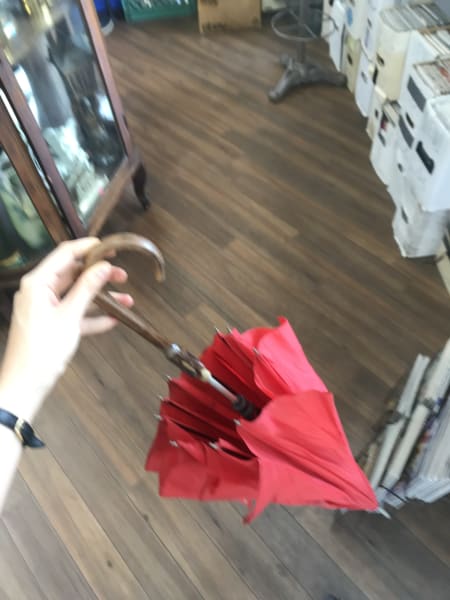 red umbrella i should have bought in thrift store in ridgewood