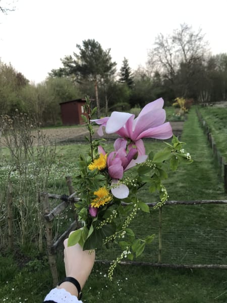 me holding up bronowice bouquet