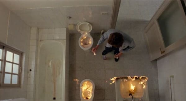 screenshot from film bianca, him burning out toilet, bath, sink in new apartment