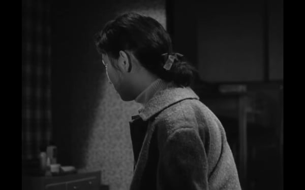 screenshot from tokyo twilight girl with bow in hair with head turned