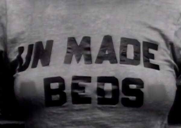 screenshot of tshirt that has text i think made out of tape written unmade beds