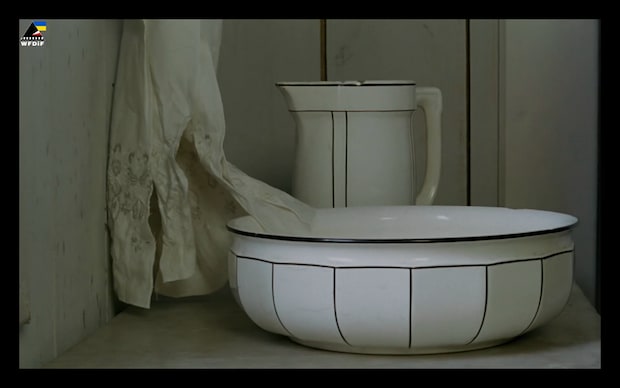 Andrzej Barański - Tabu (1988), white enamel wash basin jug towel hanging from wall draped a bit over the side