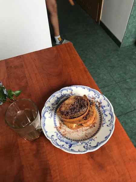 French toast Marilia made us on plate with cup on table