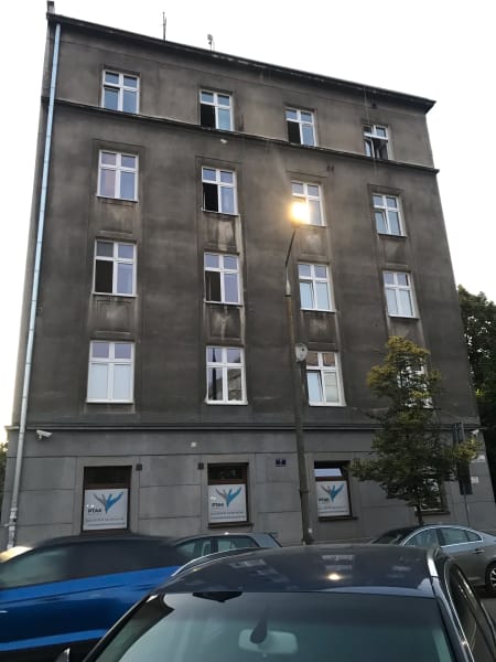 stone apartment building/kamienica near my house, love seeing the windows open at dusk