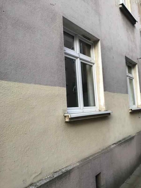 A photo of the outside of my building showing purple and yellow paint