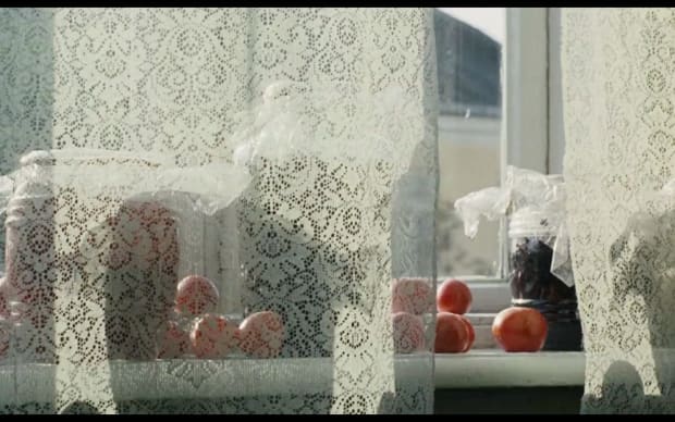 Krzysztof Zanussi - Illuminacja (1973), windowsill Polish lace curatins fruit or preserves in jars