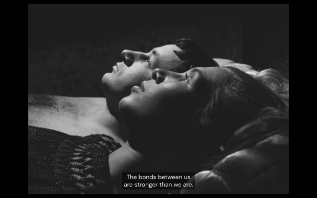 Agnes Varda - La Pointe-Courte (1955), a couple lie in bed with the subtitle the bond between us is stronger than we are