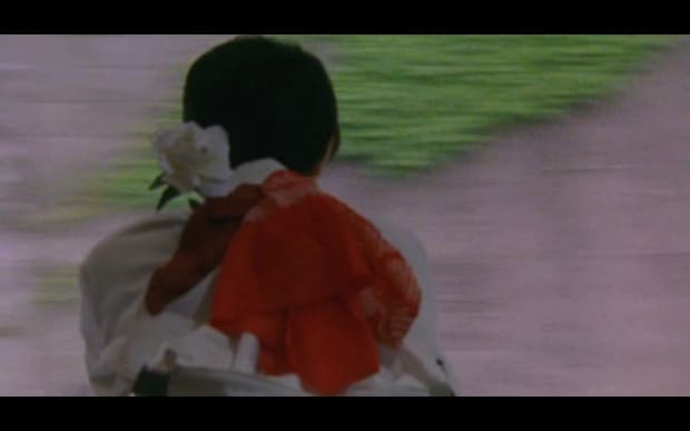 Masato Harada - Bounce Ko Gals (1997), blurry pic of girl looking out train window with big red scarf tied to backpack