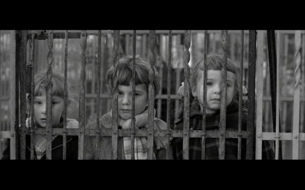 François Truffaut - The 400 Blows (1969), three young girls behind grates of a cage in black and white