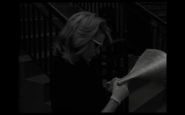 Doris Wishman - Bad Girls Go to Hell (1965), a blonde reads newspaper on street white gloves black and white blonde white 60s glasses