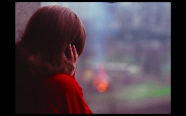 Guy Gilles - Love at Sea (1964), woman in red top looking out the window