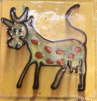 tile with image of cow from old bar mleczny in warsaw