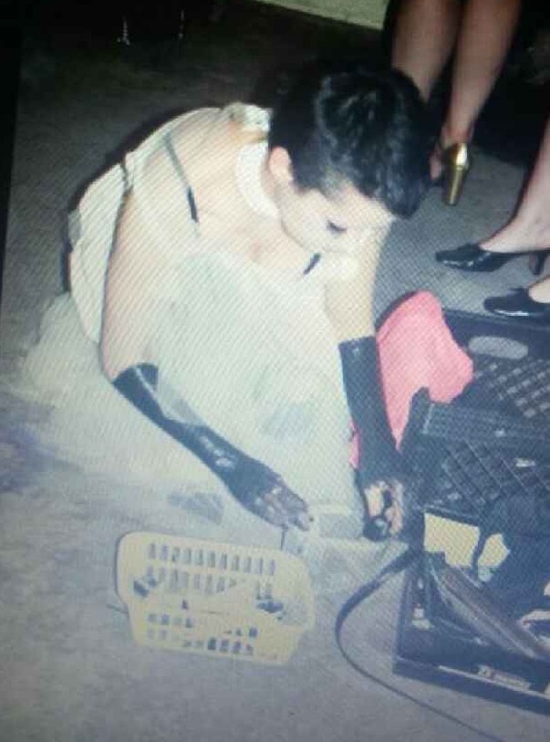 Old picture of Amy, my favourite, showing her with vinyl or black paint up to her elbows and short black hair