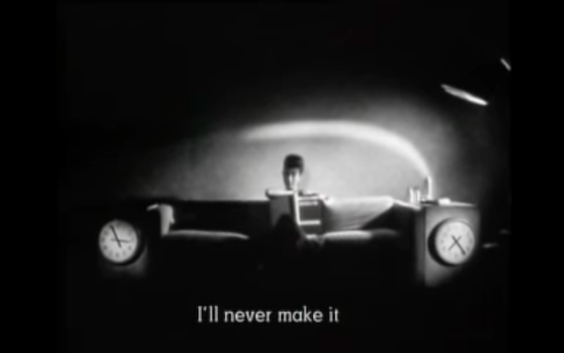 Black and white screenshot from the film Ghost Dance showing a woman sitting on a couch, with subtitle I'll never make it