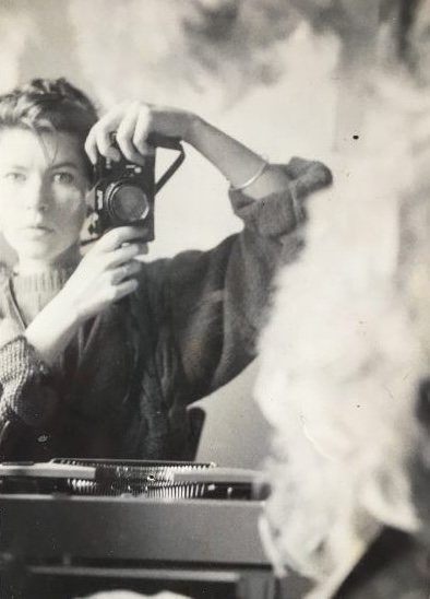 Vintage black and white photo of a woman taking her own photo, Lisa Robertson