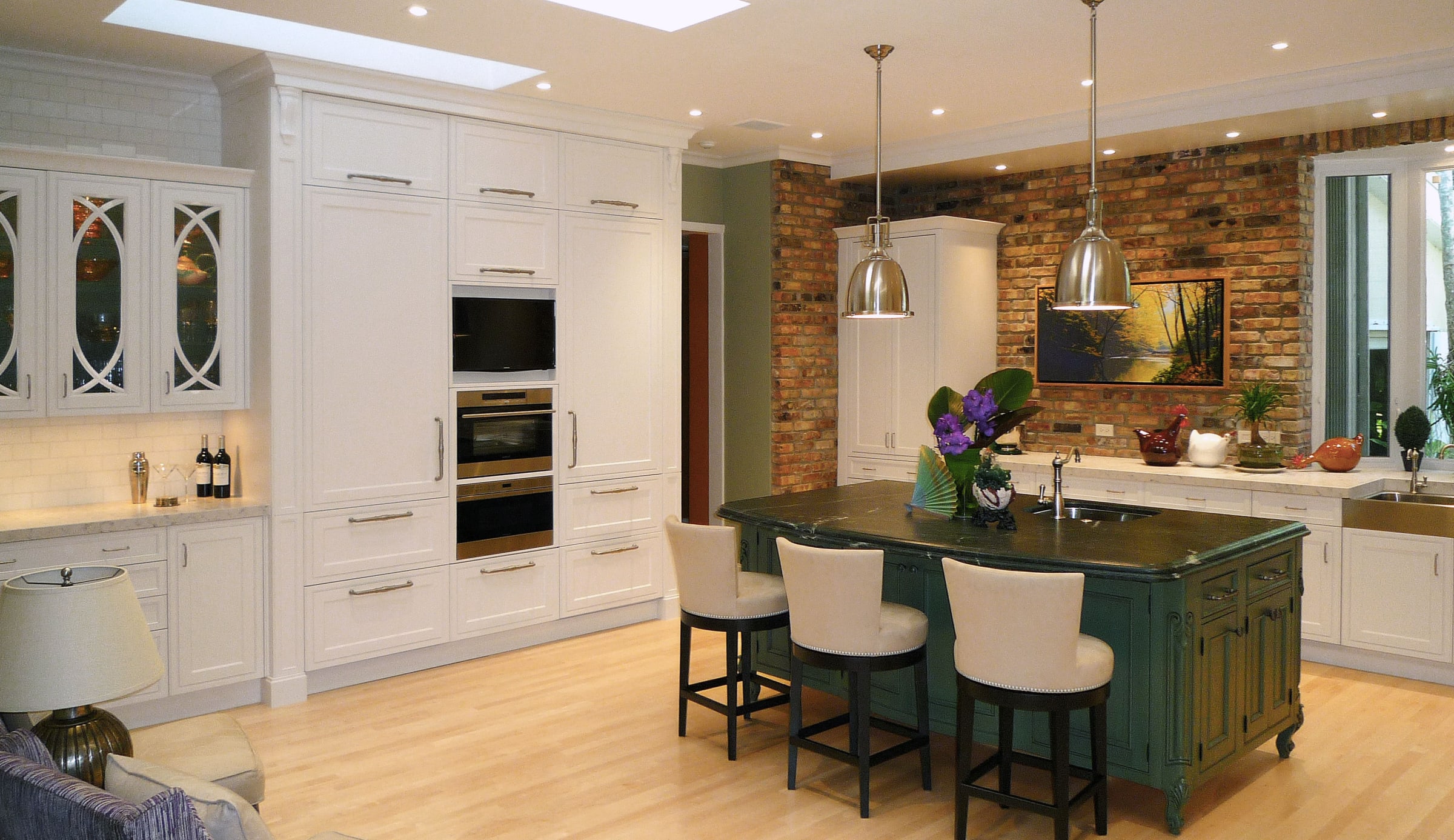 Custom kitchen designed by Kitchen Design Consultants, with full height cabinetry and a marble island