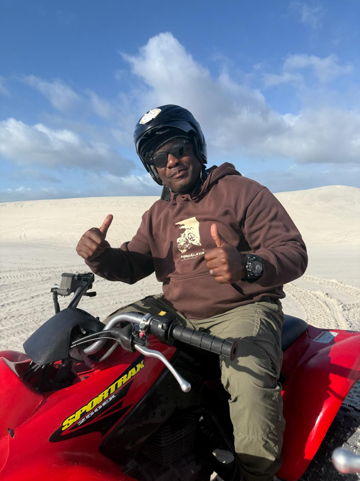 Close-up of quad bike tracks on sand