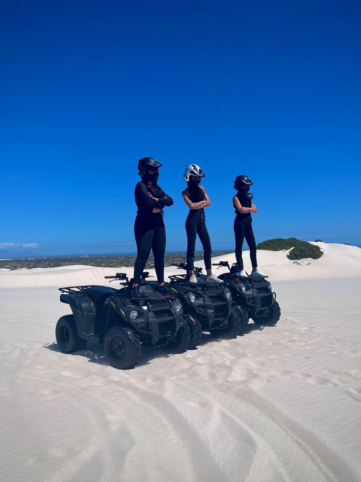 Group on dunes at golden hour