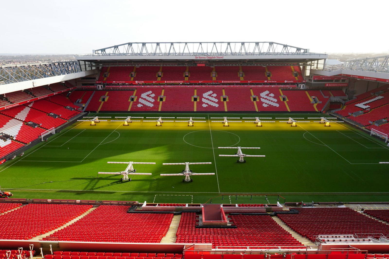 Anfield Stadium with green field and red seats