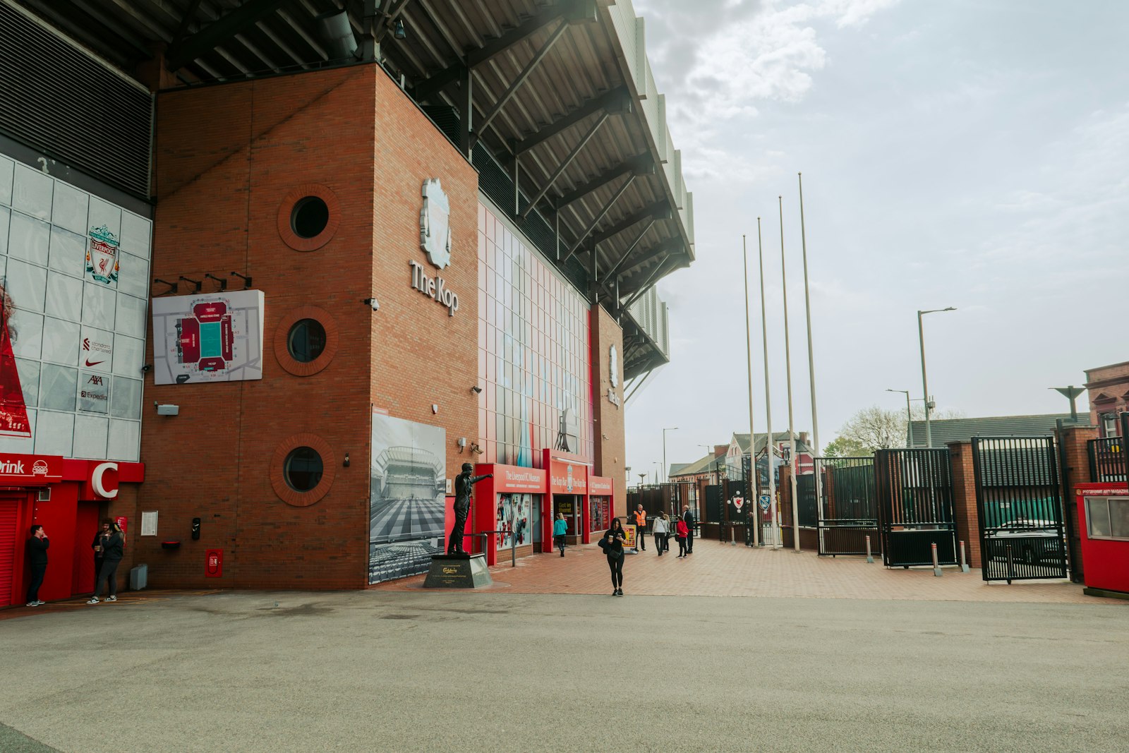 Exterior view of Anfield with fans walking to match