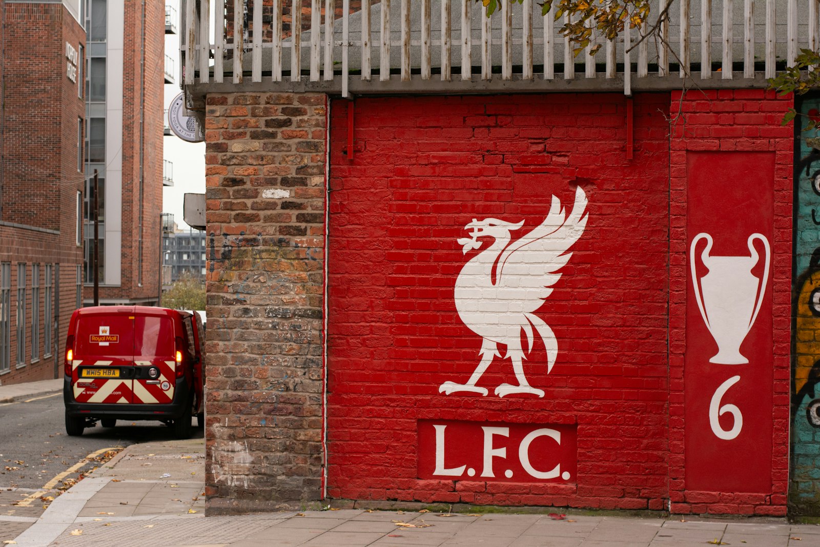 Liverpool FC crest painted on red brick wall