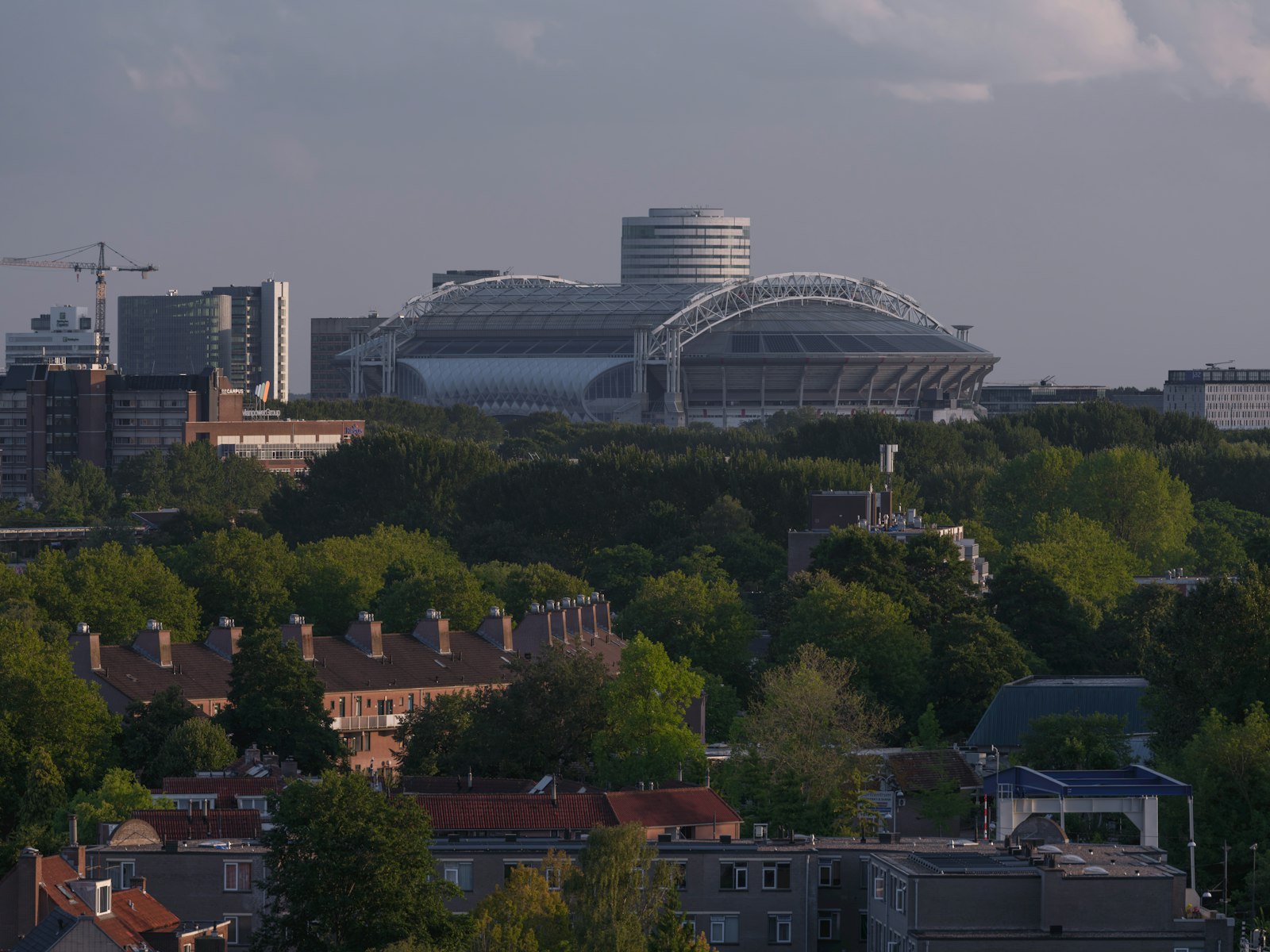 Anfield Stadium surrounded by green trees and buildings