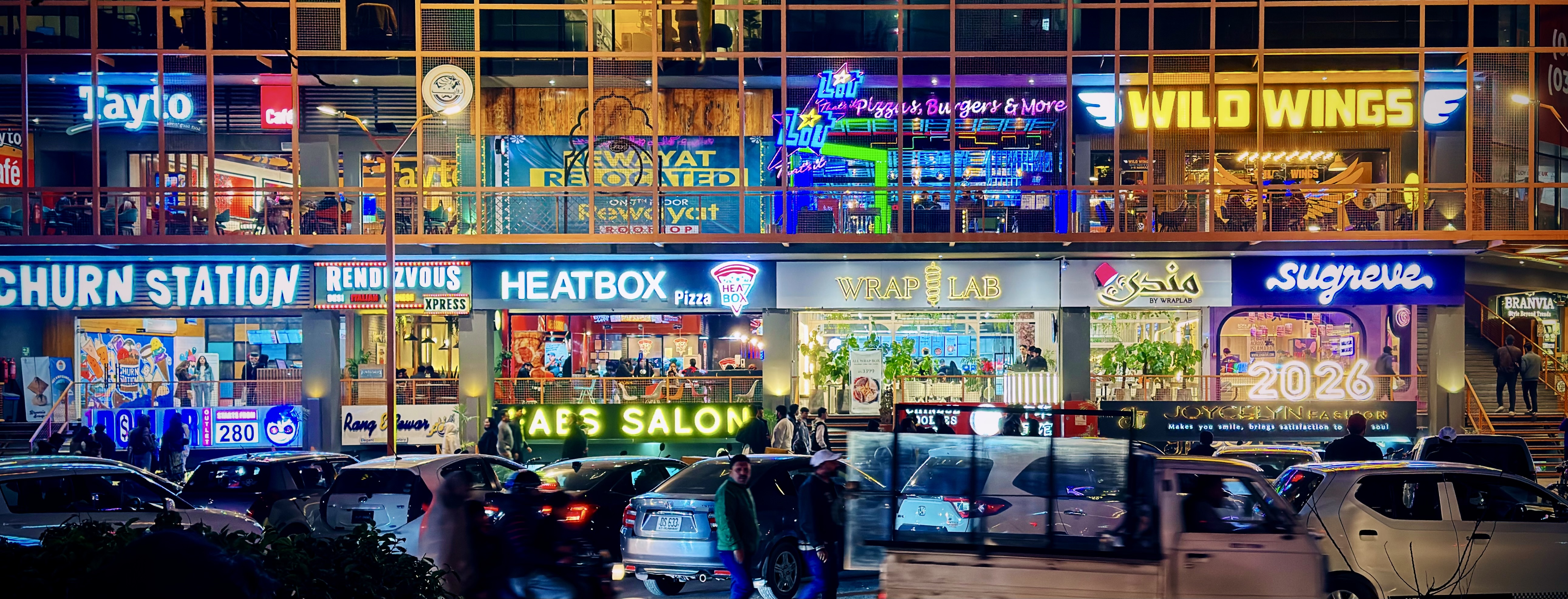 A wall of shops above a busy street