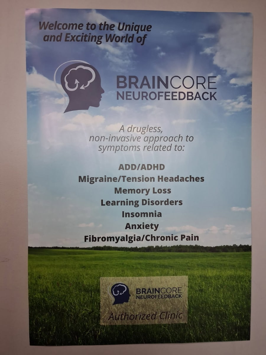 BrainCore Neurofeedback welcome poster: a drugless, non-invasive approach to symptoms related to ADD/ADHD, migraine and tension headaches, memory loss, learning disorders, insomnia, anxiety, and fibromyalgia/chronic pain. Marked as a BrainCore Authorized Clinic.