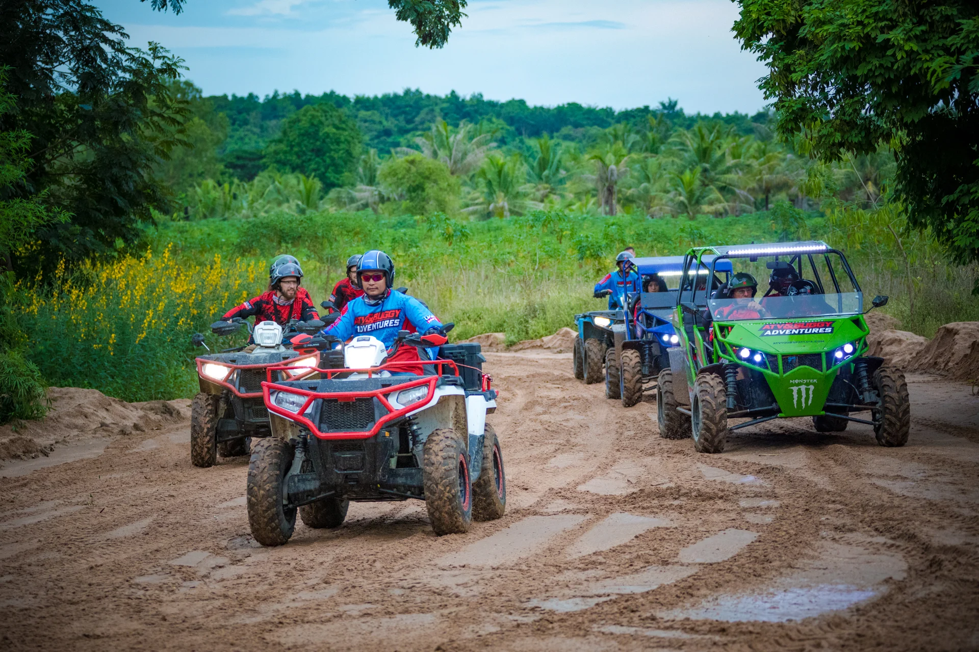 ATV trail winding through lush Thai jungle near Pattaya with varied terrain