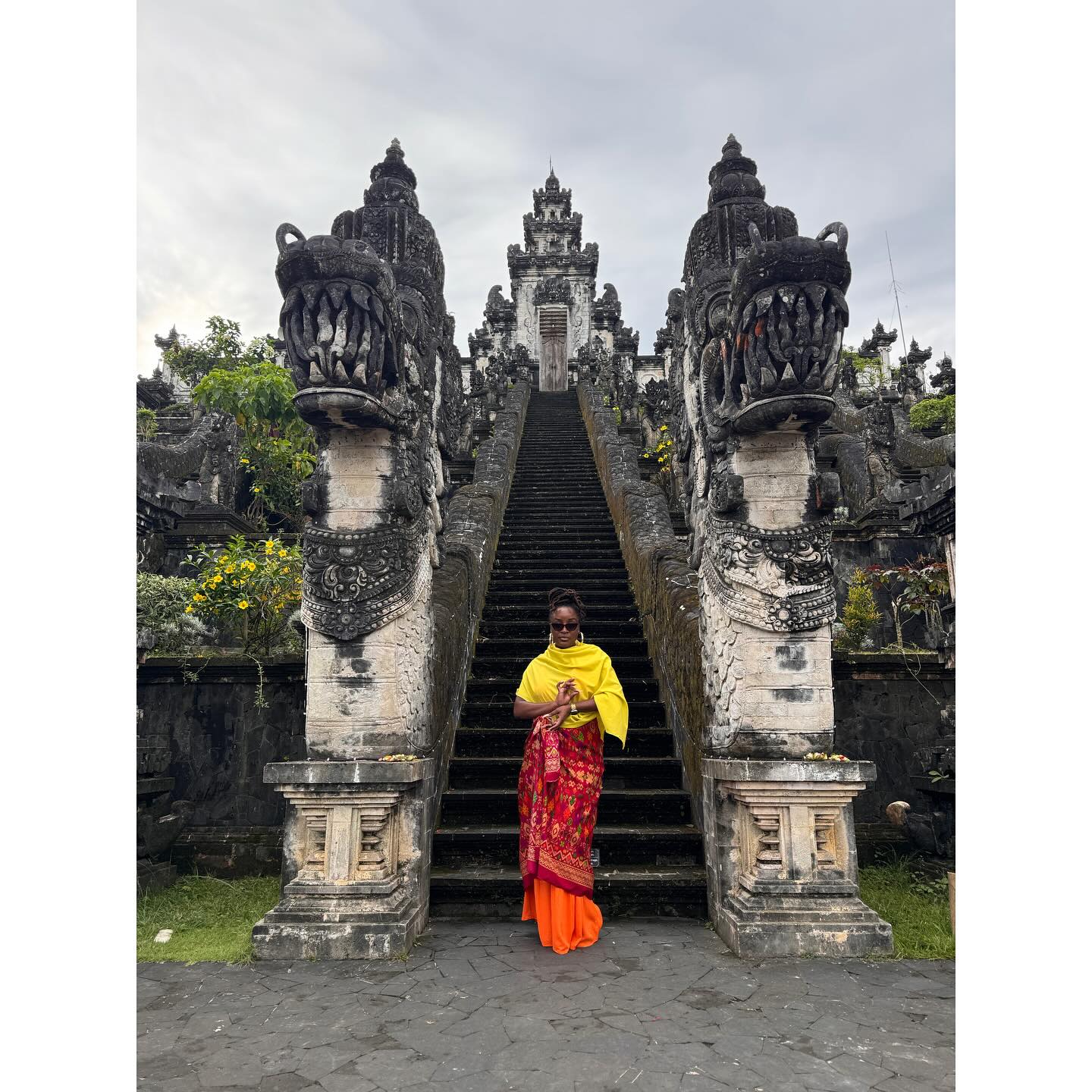An Nxlevel traveler at a temple gate in Bali