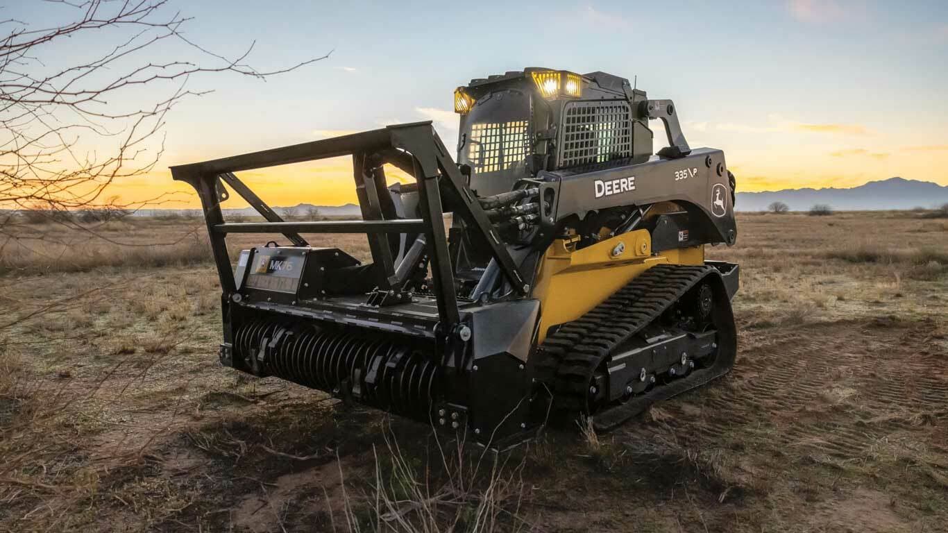 Heavy forestry mulching equipment actively clearing trees and brush